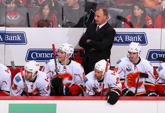 GLENDALE, AZ - DECEMBER 03:  Head coach Brent Sutter of the Calgary Flames looks on from the bench during the NHL game against the Phoenix Coyotes at Jobing.com Arena on December 3, 2009 in Glendale, Arizona.  The Coyotes defeated the Flames 2-1.  (Photo by Christian Petersen/Getty Images)