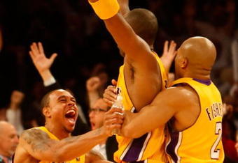 LOS ANGELES, CA - DECEMBER 04:  (L-R) Shannon Brown #12, Kobe Bryant #24 and Derek Fisher #2 of the Los Angeles Lakers celebrate after Bryant's game winning three point basket as time expired against the Miami Heat at Staples Center on December 4, 2009 in Los Angeles, California. The Lakers defeated the Heat 108-107. NOTE TO USER: User expressly acknowledges and agrees that, by downloading and/or using this Photograph, user is consenting to the terms and conditions of the Getty Images License Agreement.  (Photo by Jeff Gross/Getty Images)