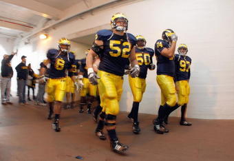 ANN ARBOR, MI - NOVEMBER 21: Kevin Leach #52 of the Michigan Wolverines jogs through the tunnel before the game against the Ohio State Buckeyes on November 21, 2009 at Michigan Stadium in Ann Arbor, Michigan. Ohio State won the game 21-10. (Photo by Gregory Shamus/Getty Images)