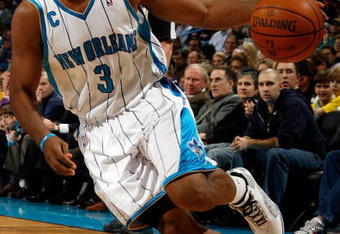 NEW ORLEANS - DECEMBER 16:  Chris Paul #3 of the New Orleans Hornets drives the ball against the Detroit Pistons at New Orleans Arena on December 16, 2009 in New Orleans, Louisiana. NOTE TO USER: User expressly acknowledges and agrees that, by downloading and/or using this Photograph, user is consenting to the terms and conditions of the Getty Images License Agreement. (Photo by Chris Graythen/Getty Images)