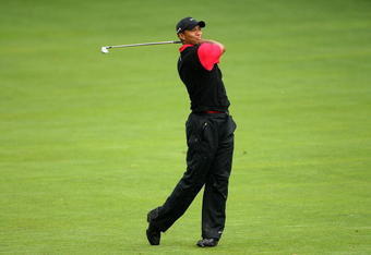 FARMINGDALE, NY - JUNE 21:  Tiger Woods watches a shot on the fifth hole during the continuation of the third round of the 109th U.S. Open on the Black Course at Bethpage State Park on June 21, 2009 in Farmingdale, New York.  (Photo by Andrew Redington/Getty Images)
