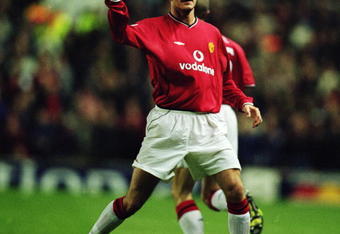 26 Feb 2002:  David Beckham of Manchester United celebrates his goal during the UEFA Champions League Second Stage Group A match against Nantes played at Old Trafford, in Manchester, England. Manchester United won the match 5-1. \ Mandatory Credit: Ben Radford /Allsport