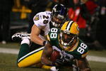 GREEN BAY, WI - DECEMBER 7:  Jermichael Finley #88 of the Green Bay Packers catches a 2-yard touchdown pass in the second quarter against Tom Zbikowski #28 of the Baltimore Ravens at Lambeau Field on December 7, 2009 in Green Bay, Wisconsin.  (Photo by Jonathan Daniel/Getty Images)