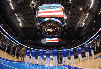 DALLAS - NOVEMBER 18:  The Dallas Mavericks during the national anthem on November 18, 2009 at American Airlines Center in Dallas, Texas.  NOTE TO USER: User expressly acknowledges and agrees that, by downloading and/or using this Photograph, user is consenting to the terms and conditions of the Getty Images License Agreement.  (Photo by Ronald Martinez/Getty Images)