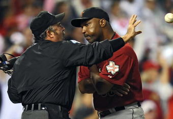 PHILADELPHIA - SEPTEMBER 28: Manager Dave Clark of the Houston Astros argues a balk call with home plate umpire Tim Tschida while he catches a ball during the game against the Philadelphia Phillies on September 28, 2009 at Citizens Bank Park in Philadelphia, Pennsylvania. (Photo by Drew Hallowell/Getty Images)