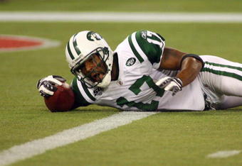 TORONTO - DECEMBER 3:  Braylon Edwards #17 of the New York Jets falls with the ball in the end zone for a touchdown during their NFL game against the Buffalo Bills on December 3, 2009  at Rogers Centre in Toronto, Ontario, Canada. The Jets defeated the Bills 19-13. (Photo by Rick Stewart/Getty Images)