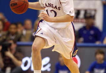 LAWRENCE, KS - FEBRUARY 18:  Brady Morningstar #12 of the Kansas Jayhawks dribbles the ball upcourt during the game against the Iowa State Cyclones on February 18, 2009 at Phog Allen Fieldhouse in Lawrence, Kansas. Kansas defeated Iowa State 72-55. (Photo by Jamie Squire/Getty Images)