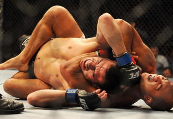 PHILADELPHIA - AUGUST 08:   Lightweight champion BJ Penn (R) battles Kenny Florian during their lightweight championship title bout at UFC 101: Declaration at the Wachovia Center on August 8, 2009 in Philadelphia, Pennsylvania.  (Photo by Jon Kopaloff/Getty Images)
