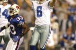 ORCHARD PARK, NY - OCTOBER 8:  Nick Folk #6 of the Dallas Cowboys celebrates his game winning field goal with seconds left as Jabari Greer #33 of the Buffalo Bills watches at Ralph Wilson Stadium October 8, 2007 in Orchard Park, New York. Dallas won 25-24.  (Photo by Rick Stewart/Getty Images)