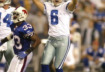 ORCHARD PARK, NY - OCTOBER 8:  Nick Folk #6 of the Dallas Cowboys celebrates his game winning field goal with seconds left as Jabari Greer #33 of the Buffalo Bills watches at Ralph Wilson Stadium October 8, 2007 in Orchard Park, New York. Dallas won 25-24.  (Photo by Rick Stewart/Getty Images)