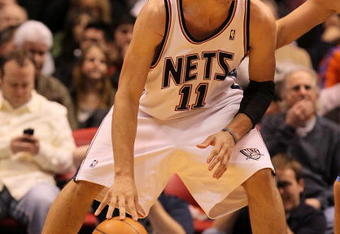 EAST RUTHERFORD, NJ - DECEMBER 16:  Brook Lopez #11 of the New Jersey Nets in action against The Utah Jazz during their game on December 16th, 2009 at The Izod Center in East Rutherford, New Jersey.  NOTE TO USER: User expressly acknowledges and agrees that, by downloading and/or using this Photograph, user is consenting to the terms and conditions of the Getty Images License Agreement. Photo By Al Bello/Getty Images  (Photo by Al Bello/Getty Images)