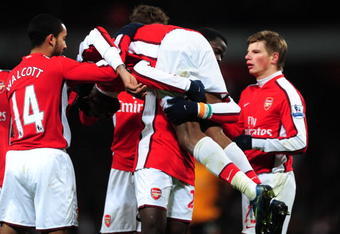 LONDON, ENGLAND - DECEMBER 19:  Abou Diaby of Arsenal celebrates with team mates after he scores the third goal of the game during the Barclays Premier League match between Arsenal and Hull City at the Emirates Stadium on December 19, 2009 in London, England.  (Photo by Mike Hewitt/Getty Images)