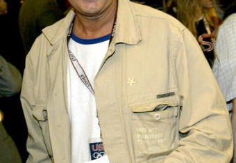 NEW YORK - MAY 13:  Comedian Chevy Chase models a Roots hat during the unveiling of the 2004 U.S. Olympic team collection at the NBC Experience store in Rockefeller Plaza May 13, 2004 in New York City. (Photo by Paul Hawthorne/Getty Images)  