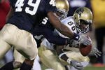 SOUTH BEND, IN - NOVEMBER 13: Linebacker Derek Curry #49 and cornerback Preston Jackson #15 of Notre Dame break up a pass intended for receiver Greg Lee #86 of Pittsburgh during a game on November 13, 2004 at Notre Dame Stadium in South Bend, Indiana. Pittsburgh defeated Notre Dame 41-38. (Photo by Jonathan Daniel/Getty Images)