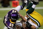 MINNEAPOLIS - NOVEMBER 09:  Defensive end Jared Allen #69 of the Minnesota Vikings sacks quarterback Aaron Rodgers #12 of the Green Bay Packers on November 9, 2008 at the Metrodome in Mineapolis, Minnesota.  (Photo by Stephen Dunn/Getty Images)