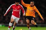 LONDON, ENGLAND - DECEMBER 19:  Eduardo of Arsenal battles with Geovanni of Hull during the Barclays Premier League match between Arsenal and Hull City at the Emirates Stadium on December 19, 2009 in London, England.  (Photo by Mike Hewitt/Getty Images)