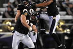 BALTIMORE - DECEMBER 20:  Ray Lewis #52, Kelly Gregg #97and Paul Kruger #99 of the Baltimore Ravens celebrate a play against the Chicago Bears at M&T Bank Stadium on December 20, 2009 in Baltimore, Maryland. The Ravens defeated the Bears 31-7. (Photo by Larry French/Getty Images)