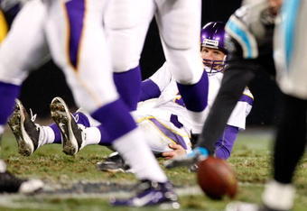 CHARLOTTE, NC - DECEMBER 20:  Quarterback Brett Favre #4 of the Minnesota Vikings sits on the ground after an incomplete pass against the Carolina Panthers at Bank of America Stadium on December 20, 2009 in Charlotte, North Carolina.  (Photo by Kevin C. Cox/Getty Images)