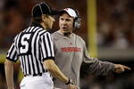 ARLINGTON, TX - DECEMBER 5:  Head coach Bo Pelini of the Nebraska Cornhuskers speaks to the referee during the first quarter of the game the Texas Longhorns at Cowboys Stadium on December 5, 2009 in Arlington, Texas.  (Photo by Jamie Squire/Getty Images)