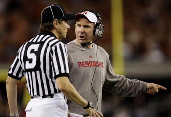 ARLINGTON, TX - DECEMBER 5:  Head coach Bo Pelini of the Nebraska Cornhuskers speaks to the referee during the first quarter of the game the Texas Longhorns at Cowboys Stadium on December 5, 2009 in Arlington, Texas.  (Photo by Jamie Squire/Getty Images)