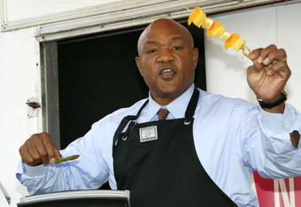 LONDON, UNITED KINGDOM - OCTOBER 20:  Former world heavyweight boxing champion George Foreman demonstrates how to cook healthy food on his trademark grill on October 20, 2006 in London, England. He is in London to celebrate the tenth anniversary of his iconic brand and to officially launch a new fundraising partnership between George Foreman Grills and the British Heart Foundation - with the aim of raising GBP300,000 for the charity.  (Photo by Jeremy O'Donnell/Getty Images)