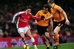 LONDON, ENGLAND - DECEMBER 19:  Samir Nasri of Arsenal beats Stephen Hunt of Hull during the Barclays Premier League match between Arsenal and Hull City at the Emirates Stadium on December 19, 2009 in London, England.  (Photo by Mike Hewitt/Getty Images)