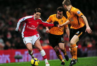 LONDON, ENGLAND - DECEMBER 19:  Samir Nasri of Arsenal beats Stephen Hunt of Hull during the Barclays Premier League match between Arsenal and Hull City at the Emirates Stadium on December 19, 2009 in London, England.  (Photo by Mike Hewitt/Getty Images)