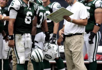HOUSTON - SEPTEMBER 13:  Quarterback Mark Sanchez #6 of the New York Jets talks with offensive coordinator Brian Schottenheimer at Reliant Stadium on September 13, 2009 in Houston, Texas.  (Photo by Bob Levey/Getty Images)
