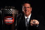 HOLLYWOOD, FL - NOVEMBER 17:  Driver Johnny Benson poses with the Champions trophy and ring at the NASCAR Craftsman Truck Series Awards Banquet at the Hard Rock Hotel and Casino  on November 17, 2008 in Hollywood, Florida.  (Photo by Marc Serota/Getty Images for NASCAR)