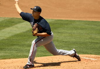 LOS ANGELES - AUGUST 9: Pitcher Javier Vazquez #33 of the Atlanta Braves throws a pitch against the Los Angeles Dodgers on August 9, 2009 at Dodger Stadium in Los Angeles, California. The Braves won 8-2.  (Photo by Stephen Dunn/Getty Images)