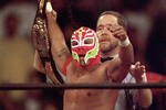 SAN DIEGO - JULY 12:  New cruiserweight champion Rey Mysterio Jr acknowledges the crowd after defeating Jericho during the WWE Bash at the Beach event at Cox Arena in San Diego, California on July 12, 1998.  (Photo by Elsa /Getty Images) 