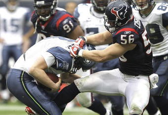 HOUSTON - DECEMBER 13:  Quarterback Matt Hasselbeck #8 of the Seattle Seahawks is sacked by linebacker Brian Cushing #56 of the Houston Texans in the third quarter at Reliant Stadium on December 13, 2009 in Houston, Texas. Houston won 34-7. (Photo by Bob Levey/Getty Images)