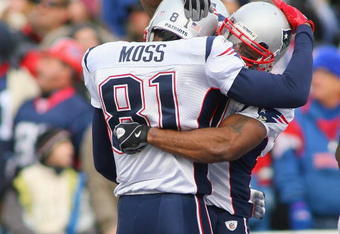 ORCHARD PARK, NY - DECEMBER 20: Randy Moss #81 and Sammy Morris #34 of the New England Patriots celebrate Moss's touchdown in the second quarter against the Buffalo Bills  at Ralph Wilson Stadium on December 20, 2009 in Orchard Park, New York.  (Photo by Rick Stewart/Getty Images)