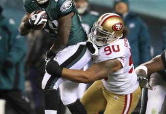 PHILADELPHIA - DECEMBER 20: LeSean McCoy #29 of the Philadelphia Eagles is tackled by Isaac Sopaga #90 of the San Francisco 49ers at Lincoln Financial Field on December 20, 2009 in Philadelphia, Pennsylvania.  (Photo by Nick Laham/Getty Images)