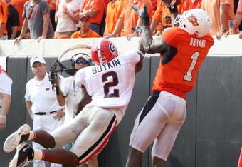 STILLWATER, OK - SEPTEMBER 5:  Runningback Brandon Boykin #2 of the Georgia Bulldogs dives for the ball for the ball as Dez Bryant #1 of the Oklahoma State Cowboys cannot make the pass during the third quarter of the game at Boone Pickens Stadium on September 5, 2009 in Stillwater, Oklahoma. (Photo by Christian Petersen/Getty Images)