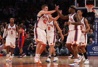 NEW YORK - DECEMBER 18:  David Lee #42 and Al Harrington #7 of the New York Knicks celebrate a basket against the Los Angeles Clippers at Madison Square Garden on December 18, 2009 in New York, New York. NOTE TO USER: User expressly acknowledges and agrees that, by downloading and or using this photograph, User is consenting to the terms and conditions of the Getty Images License Agreement. Mandatory Copyright Notice: Copyright 2009 NBAE  (Photo by Nick Laham/Getty Images)