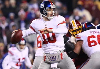 LANDOVER, MD - DECEMBER 21:  Quarterback Eli Manning #10 of the New York Giants drops back to pass against the Washington Redskins at FedEx Field on December 21, 2009 in Landover, Maryland. (Photo by Win McNamee/Getty Images)