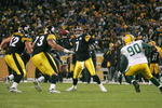 PITTSBURGH - DECEMBER 20: Ben Roethlisberger #7 of the Pittsburgh Steelers throws the game winning touchdown pass in the fourth quarter in front of BJ Raji #90 of the Green Bay Packers during the game on December 20, 2009 at Heinz Field in Pittsburgh, Pennsylvania. (Photo by Jared Wickerham/Getty Images)
