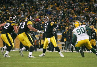 PITTSBURGH - DECEMBER 20: Ben Roethlisberger #7 of the Pittsburgh Steelers throws the game winning touchdown pass in the fourth quarter in front of BJ Raji #90 of the Green Bay Packers during the game on December 20, 2009 at Heinz Field in Pittsburgh, Pennsylvania. (Photo by Jared Wickerham/Getty Images)