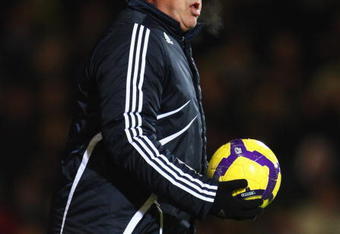 LONDON, ENGLAND - DECEMBER 20:  Carlo Ancelotti, Manager of Chelsea gathers the ball during the Barclays Premier League match between West Ham United and Chelsea at Upton Park on December 20, 2009 in London, England.  (Photo by Phil Cole/Getty Images)