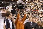 ARLINGTON, TX - DECEMBER 5: Head coach Mack Brown of the Texas Longhorns lifts the trophy after his teams 10-6 victory over the Nebraska Cornhuskers in the game at Cowboys Stadium on December 5, 2009 in Arlington, Texas. (Photo by Jamie Squire/Getty Images)
