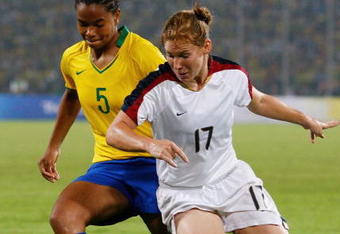 BEIJING - AUGUST 21:  Costa Renata #5 of Brazil and Lori Chalupny #17 of United States battle for the ballduring the Women's Football Gold Medal match between Brazil and the United States on Day 13 of the Beijing 2008 Olympic Games on August 21, 2008 at Worker's Stadium in Beijing, China.  (Photo by Cameron Spencer/Getty Images)