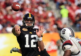 TAMPA, FL - JANUARY 01:  Ricky Stanzi #12 of the Iowa Hawkeyes drops back to pass against the South Carolina Gamecocks during the Outback Bowl on January 1, 2009 at Raymond James Stadium in Tampa, Florida.  (Photo by Scott Halleran/Getty Images)