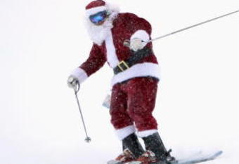 COPPER MOUNTAIN, CO - DECEMBER 13:  Santa Claus helped clear the newly fallen snow from the halfpipe during the finals of the US Snowboard Grand Prix in the Main Vein Halfpipe on December 13, 2008 in Copper Mountain, Colorado.  (Photo by Doug Pensinger/Getty Images)
