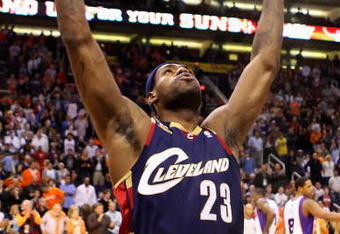 PHOENIX - DECEMBER 21:  LeBron James #23 of the Cleveland Cavaliers throws powder into the air before tip off against of the Phoenix Suns during the NBA game at US Airways Center on December 21, 2009 in Phoenix, Arizona. The Cavaliers defeated the Suns 109-91.  NOTE TO USER: User expressly acknowledges and agrees that, by downloading and or using this photograph, User is consenting to the terms and conditions of the Getty Images License Agreement.  (Photo by Christian Petersen/Getty Images)