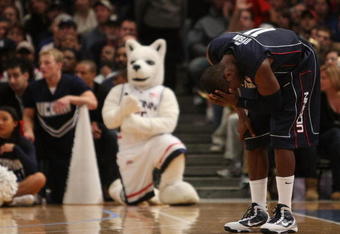 NEW YORK - NOVEMBER 27:  Jerome Dyson #11 of the Connecticut Huskies holds his head against the Duke Blue Devils  during the Championship game at Madison Square Garden on November 27, 2009 in New York, New York.  (Photo by Nick Laham/Getty Images)