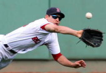 BOSTON - OCTOBER 11:  Jacoby Ellsbury #46 of the Boston Red Sox makes a diving catch on a Bobby Abreu #53 of the Los Angeles Angels of Anaheim flyout in the third inning of Game Three of the ALDS during the 2009 MLB Playoffs at Fenway Park on October 11, 2009 in Boston,  Massachusetts. (Photo by Jim Rogash/Getty Images)