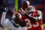KANSAS CITY, MO - DECEMBER 21:  Mark Bradley #83 of Kansas City Chiefs tries to make a reception as Will Allen #25 of the Miami Dolphins looks on during the game on December 21, 2008 at Arrowhead Stadium in Kansas City, Missouri.  (Photo by Jamie Squire/Getty Images)