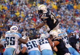 SAN DIEGO - JANUARY 06:  LaDainian Tomlinson #21 of the San Diego Chargers jumps toward the end zone en route to a touchdown in the fourth quarter against the Tennessee Titans during their AFC Wild Card Playoff Game at Qualcomm Stadium on January 6, 2008 in San Diego, California.  (Photo by Harry How/Getty Images)  