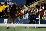 NEW YORK - SEPTEMBER 12:  Serena Williams (L) argues with a line judge during her Women's Singles Semifinal match against Kim Clijsters of Belgium on day thirteen of the 2009 U.S. Open at the USTA Billie Jean King National Tennis Center on September 12, 2009 in the Flushing neighborhood of the Queens borough of New York City.  Clijsters defeated Williams 6-4, 7-5.  (Photo by Julian Finney/Getty Images)
